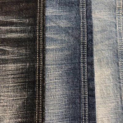 ジーンズの人のための12.6oz 99%の綿1%のスパンデックスのあや織りの粗紡糸の伸張のあや目陰影のデニムの生地